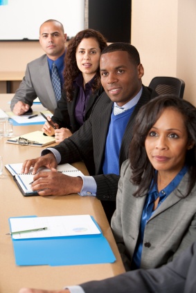 iStock_Professionals_At_Table__Vertical_extraSmall1